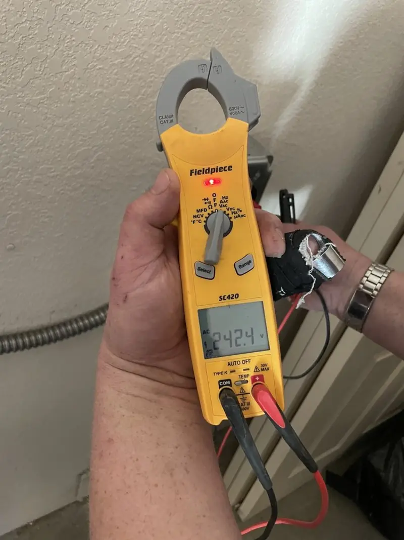 Voltage testing with clamp meter during Outlet Installation in Rainsville